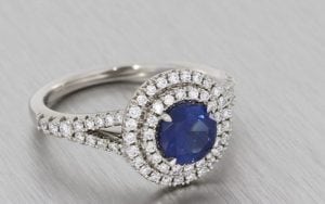 A Striking Sapphire And Diamond Double Halo Ring