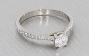 Four-Claw Solitaire Ring with Diamond-Set Shoulders - Portfolio