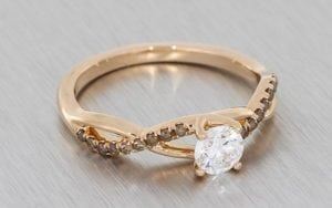 Warm Rose Gold And Cognac Diamond Ring With Entwined Ring Shank And White Diamond Centre Stone - Portfolio