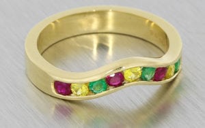 A Distinct Channel Set Ring Set With A Mouth Watering Mix Of Colourful Round Cut Stones
