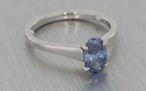 Blue Diamond and Platinum Ring with a Soft Swooping Taper
