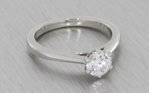 Platinum Round brilliant diamond ring with a matching diamond wedding band