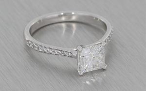 Platinum Princess cut diamond ring with diamond pave shoulders