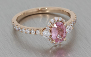 Rose Gold Ring Set with a Pastel Pink Sapphire, Diamond Halo and Shoulders